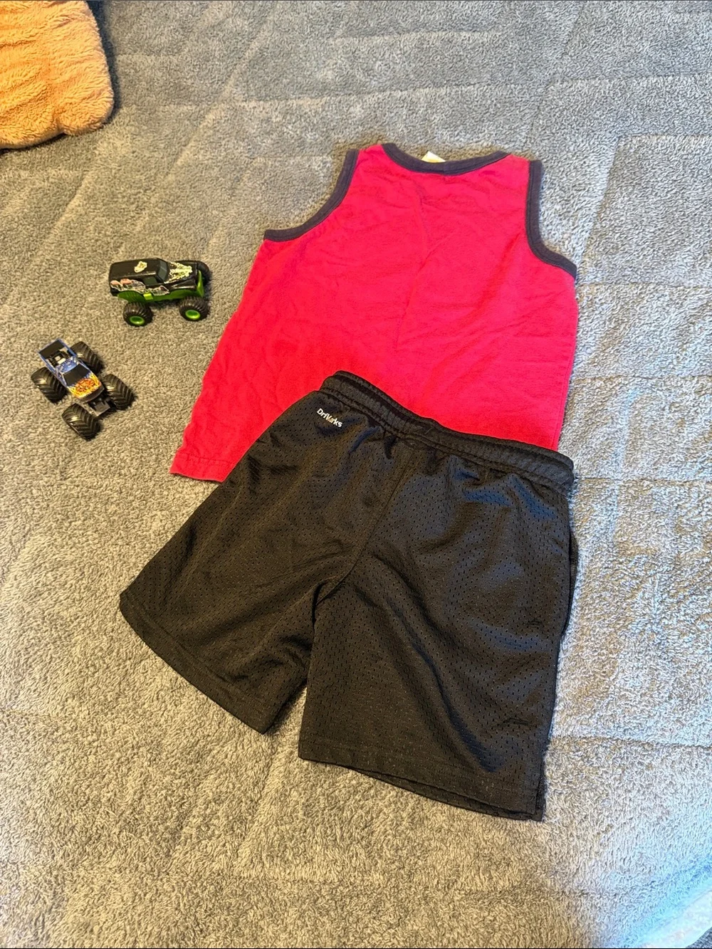 Red Shark Tank Top with Black Athletic Shorts